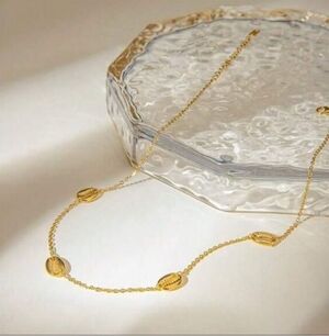 Anthropologie Gold Cowrie Shell Station Necklace